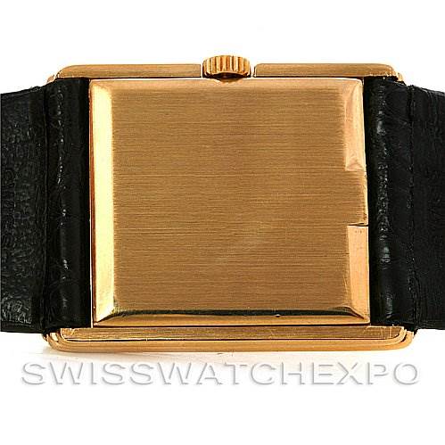 This image shows a rear view of the Rolex Cellini 4106 Men's Yellow Gold Blue Dial 4106 Men's Yellow Gold Blue Dial watch, highlighting its square gold case and black leather strap.