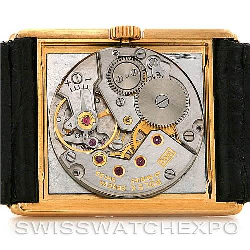 This image shows the internal mechanism of a Rolex Cellini 4106 Men's Yellow Gold Blue Dial 4106 Men's Yellow Gold Blue Dial watch viewed from the back with its case open.