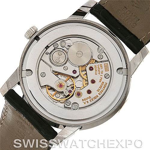 The image shows the back view of a Rolex Cellini 5116/9 White Gold Silver Dial 5116/9 White Gold Silver Dial watch, highlighting its exposed movement and internal mechanics.