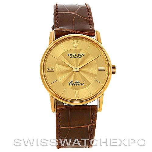 This image shows a frontal view of a Rolex Cellini 5116 Yellow Gold Champagne Dial 5116 Yellow Gold Champagne Dial watch with a gold dial and brown leather strap.