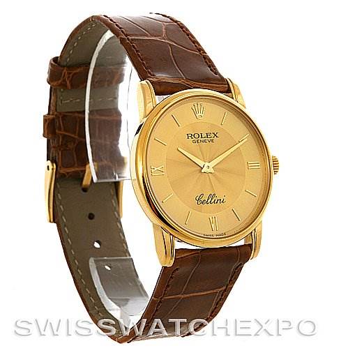 The image shows a side view of the Rolex Cellini 5116 Yellow Gold Champagne Dial 5116 Yellow Gold Champagne Dial watch, highlighting its gold case, brown leather strap, and gold dial.