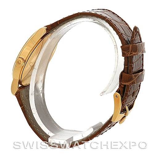 This image shows a side view of a Rolex Cellini 5116 Yellow Gold Champagne Dial 5116 Yellow Gold Champagne Dial watch featuring a brown leather strap and a gold buckle.