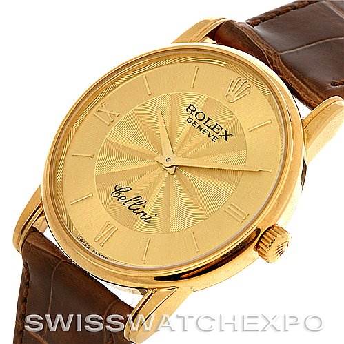 The Rolex Cellini 5116 Yellow Gold Champagne Dial 5116 Yellow Gold Champagne Dial watch is shown at an angled view displaying its gold dial, Roman numerals, crown, and brown leather strap.