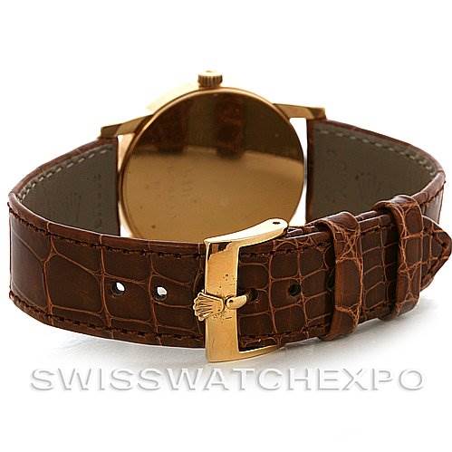 The image shows the back view of the Rolex Cellini 5116 Yellow Gold Champagne Dial 5116 Yellow Gold Champagne Dial watch, highlighting the leather strap and buckle.