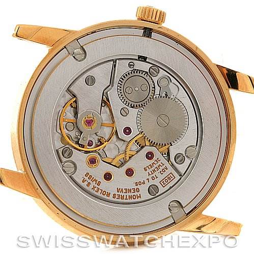 This image shows the backside of a Rolex Cellini 5116 Yellow Gold Champagne Dial 5116 Yellow Gold Champagne Dial watch, revealing its intricate mechanical movement.
