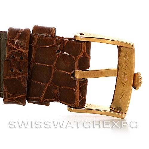 The image shows a close-up side view of the leather strap and gold buckle of a Rolex Cellini 5116 Yellow Gold Champagne Dial 5116 Yellow Gold Champagne Dial watch.