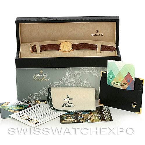 The image shows a Rolex Cellini 5116 Yellow Gold Champagne Dial 5116 Yellow Gold Champagne Dial watch with its box, booklet, warranty card, and cleaning cloth.