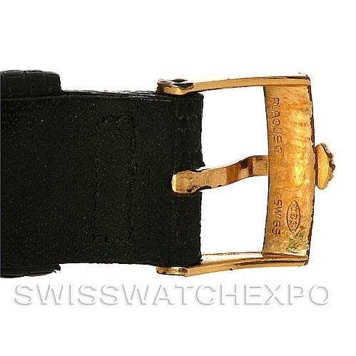 The image shows a close-up of the gold buckle and black strap of a Rolex Cellini 4012 Men's Yellow Gold Blue Dial 4012 Men's Yellow Gold Blue Dial watch. 