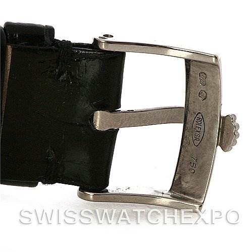 The image shows a close-up of the buckle and part of the leather strap of a Rolex Cellini 5115 White Gold Silver Dial 5115 White Gold Silver Dial watch.