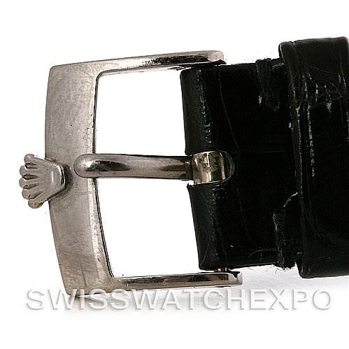 This is a close-up view of the buckle on a black leather strap of a Rolex Cellini 5115 White Gold Silver Dial 5115 White Gold Silver Dial watch.