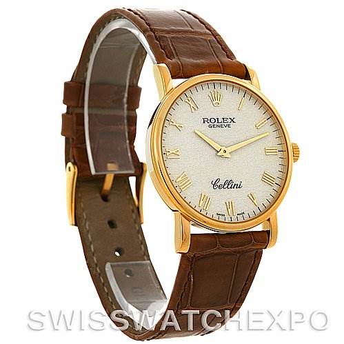 The Rolex Cellini 5115 Men's Yellow Gold Beige Dial 5115 Men's Yellow Gold Beige Dial watch is shown at an angled side view, displaying the gold case, white dial, gold hands, and brown leather strap.