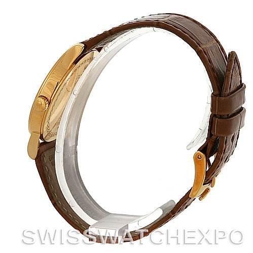 The image shows a side profile angle of a Rolex Cellini 5115 Men's Yellow Gold Beige Dial 5115 Men's Yellow Gold Beige Dial watch, highlighting the leather strap and gold case.