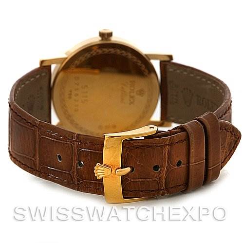 This image shows the back and clasp of a Rolex Cellini 5115 Men's Yellow Gold Beige Dial 5115 Men's Yellow Gold Beige Dial watch with a brown leather strap.