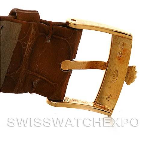 This image shows a close-up of the buckle and part of the leather strap of a Rolex Cellini 5115 Men's Yellow Gold Beige Dial 5115 Men's Yellow Gold Beige Dial watch.