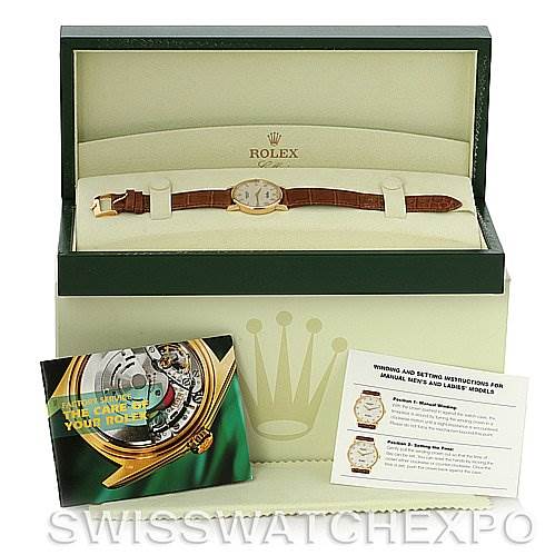 The image shows a Rolex Cellini 5115 Men's Yellow Gold Beige Dial 5115 Men's Yellow Gold Beige Dial watch in its open box, along with manuals and care instructions.