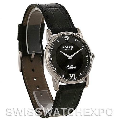 The Rolex Cellini 5116 White Gold Black Dial 5116 White Gold Black Dial watch is shown at an angle highlighting the face and black leather strap.