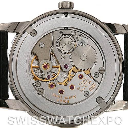 The image shows the backside of a Rolex Cellini 5116 White Gold Black Dial 5116 White Gold Black Dial watch, focusing on its exposed mechanical movement and internal components.