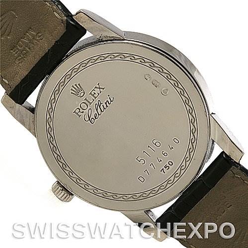 The image shows the back case of a Rolex Cellini 5116 White Gold Black Dial 5116 White Gold Black Dial watch with engravings and a portion of the leather strap.