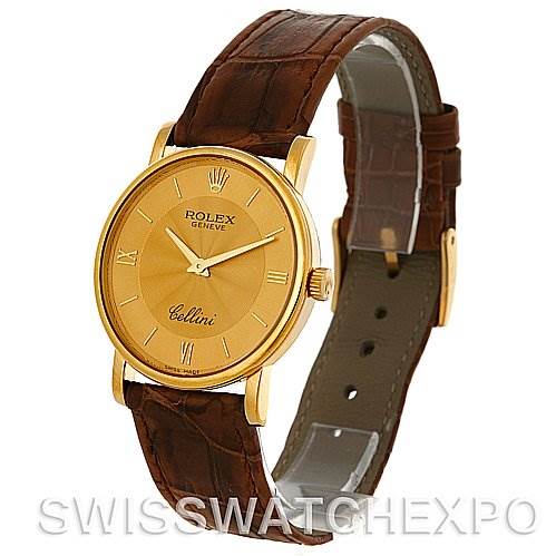 This image shows a Rolex Cellini 5115 Men's Yellow Gold Champagne Dial 5115 Men's Yellow Gold Champagne Dial watch from a front-side angle, displaying its gold case, dial, and brown leather strap.