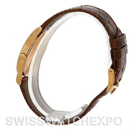 This side view image of the Rolex Cellini 5115 Men's Yellow Gold Champagne Dial 5115 Men's Yellow Gold Champagne Dial watch shows the brown leather strap and gold buckle clasp.