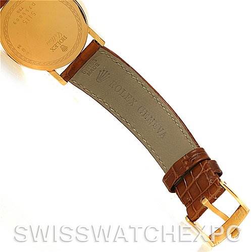 The image shows the backside of a Rolex Cellini 5115 Men's Yellow Gold Champagne Dial 5115 Men's Yellow Gold Champagne Dial watch, highlighting the leather strap and buckle.