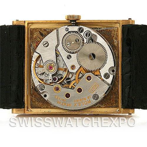 This image shows the internal mechanical movement of the Rolex Cellini 4014 Men's Yellow Gold Champagne Dial 4014 Men's Yellow Gold Champagne Dial watch from the back, revealing gears and components.