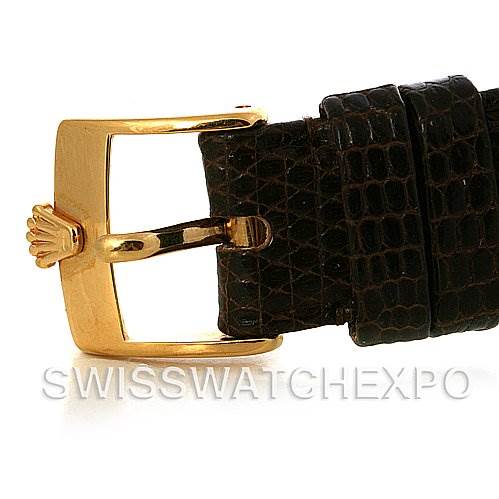 The image shows the buckle and part of the leather strap of a Rolex Cellini 4114 Men's Yellow Gold Champagne Dial 4114 Men's Yellow Gold Champagne Dial watch, featuring a gold clasp.