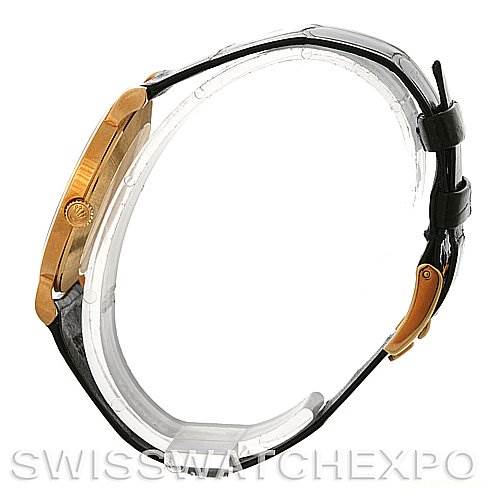 The image shows a side view of the Rolex Cellini 5112 Men's Yellow Gold Mother of Pearl Dial 5112 Men's Yellow Gold Mother of Pearl Dial watch, highlighting the case, crown, and leather strap.