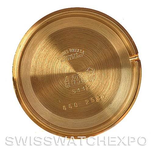 This image shows the inside of the case back of a Rolex Cellini 5112 Men's Yellow Gold Mother of Pearl Dial 5112 Men's Yellow Gold Mother of Pearl Dial watch, featuring engravings and markings.