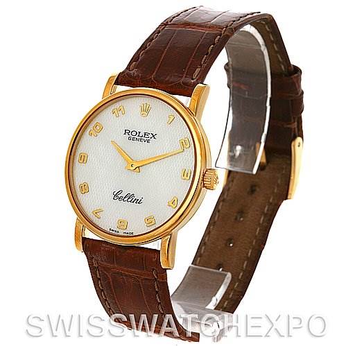 The Rolex Cellini 5115 Men's Yellow Gold Mother of Pearl Dial 5115 Men's Yellow Gold Mother of Pearl Dial watch is shown at a slight angle, displaying its face, gold-tone case, brown leather strap, and crown.
