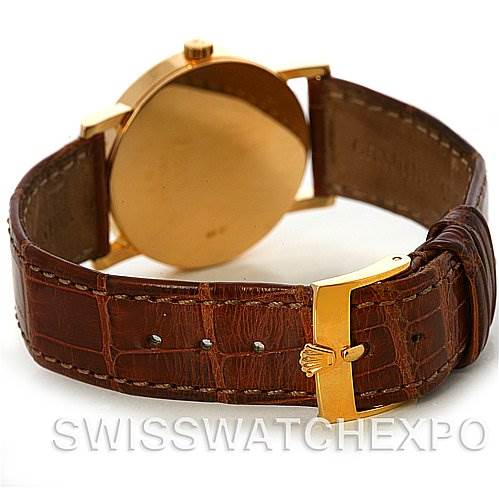 This image shows the back and side of the Rolex Cellini 5115 Men's Yellow Gold Mother of Pearl Dial 5115 Men's Yellow Gold Mother of Pearl Dial watch, featuring a gold case and brown leather strap with a gold clasp.