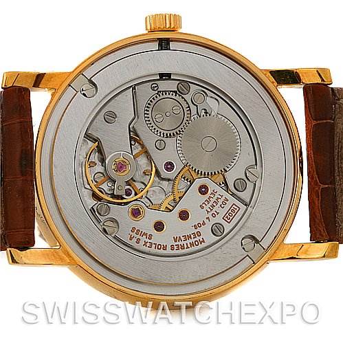 This image shows the back view of a Rolex Cellini 5115 Men's Yellow Gold Mother of Pearl Dial 5115 Men's Yellow Gold Mother of Pearl Dial watch, revealing its internal movement and gears.