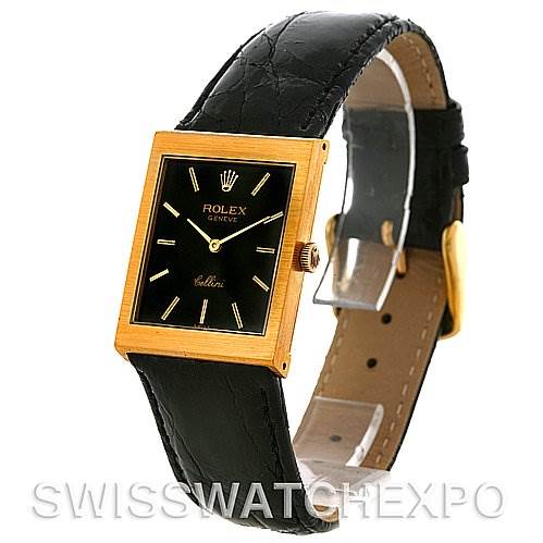 The image shows a Rolex Cellini 4014 Men's Yellow Gold Black Dial 4014 Men's Yellow Gold Black Dial watch from a slight side angle, featuring its black leather strap, gold square case, and black dial.