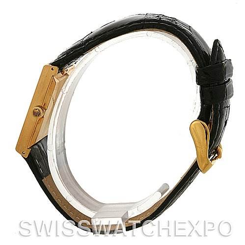 This image shows the side profile of the Rolex Cellini 4014 Men's Yellow Gold Black Dial 4014 Men's Yellow Gold Black Dial watch, highlighting its black leather strap and gold case.