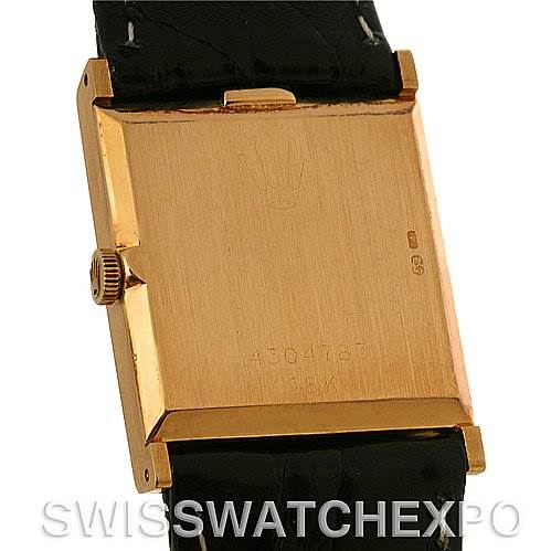 The image shows the back case of a Rolex Cellini 4014 Men's Yellow Gold Black Dial 4014 Men's Yellow Gold Black Dial watch, highlighting its gold finish and black leather strap.