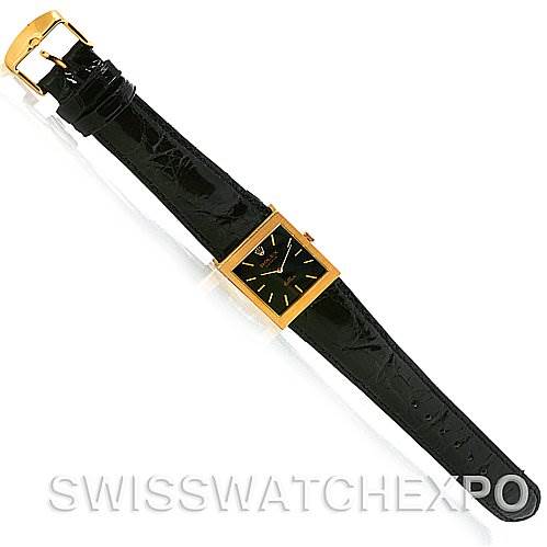 This image shows a top view of a Rolex Cellini 4014 Men's Yellow Gold Black Dial 4014 Men's Yellow Gold Black Dial watch, highlighting its rectangular face, black strap, and gold buckle.