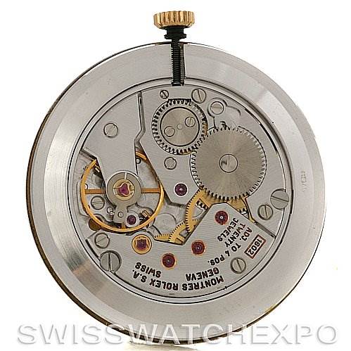 This image shows the intricate inner mechanism of the Rolex Cellini 5112 Men's Yellow Gold White Dial 5112 Men's Yellow Gold White Dial watch, highlighting gears and other components from a top angle.