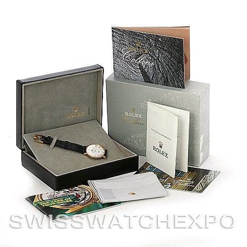 The image shows a Rolex Cellini 5112 Men's Yellow Gold White Dial 5112 Men's Yellow Gold White Dial watch with its box, warranty card, manuals, and other documentation.