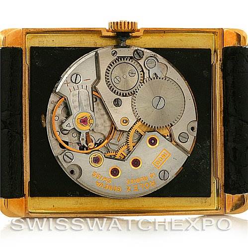 The image shows the movement and internal mechanisms of a Rolex Cellini 4105 Men's Yellow Gold Black Dial 4105 Men's Yellow Gold Black Dial watch from a back angle with the case removed.