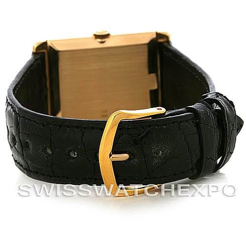 The image shows a rear angle of a Rolex Cellini 4105 Men's Yellow Gold Black Dial 4105 Men's Yellow Gold Black Dial watch, focusing on its black strap and gold buckle.