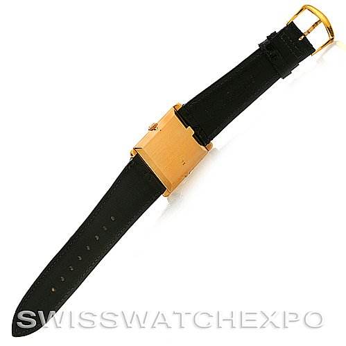 The image shows a Rolex Cellini 4105 Men's Yellow Gold Black Dial 4105 Men's Yellow Gold Black Dial model watch from a top-down angle, highlighting its black leather strap and gold rectangular case.