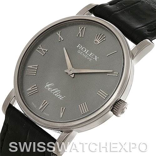 This image shows the Rolex Cellini 5115 Men's White Gold Grey Dial 5115 Men's White Gold Grey Dial watch from an angled close-up, highlighting its face, crown, and part of its leather strap.