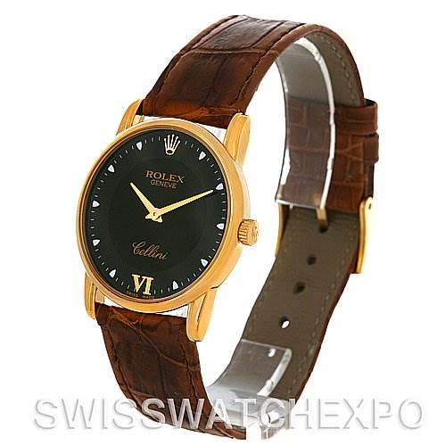 This image shows a Rolex Cellini 5116 Men's Yellow Gold Black Dial 5116 Men's Yellow Gold Black Dial watch at a slight angle, highlighting its black dial, gold case, and brown leather strap.