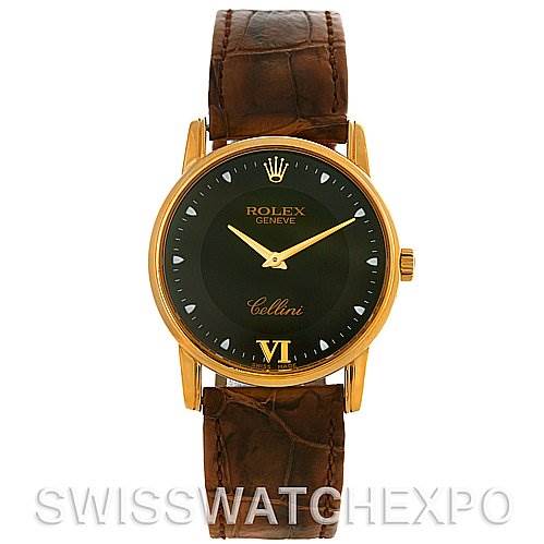 The image shows a frontal view of a Rolex Cellini 5116 Men's Yellow Gold Black Dial 5116 Men's Yellow Gold Black Dial watch, highlighting its gold case, black dial, and brown leather strap.