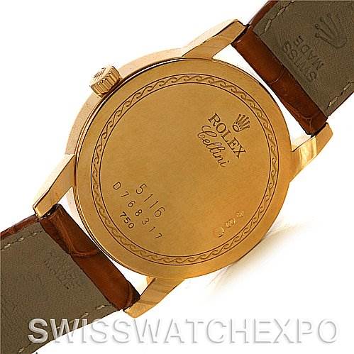 This image shows the back case and part of the leather strap of a Rolex Cellini 5116 Men's Yellow Gold Black Dial 5116 Men's Yellow Gold Black Dial watch, highlighting the engraved details.