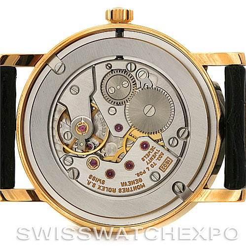 The image shows the back of a Rolex Cellini 5115 Men's Yellow Gold Black Dial 5115 Men's Yellow Gold Black Dial watch, showcasing its internal mechanical movement and components.