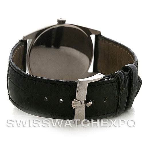 The image shows the back of a Rolex Cellini 4233 Men's White Gold White Dial 4233 Men's White Gold White Dial watch, highlighting its leather strap and clasp.