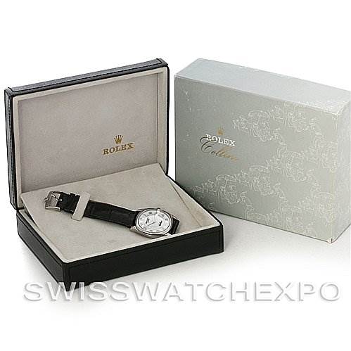 The image shows a Rolex Cellini 4233 Men's White Gold White Dial 4233 Men's White Gold White Dial watch placed inside an open watch box, next to its packaging box.