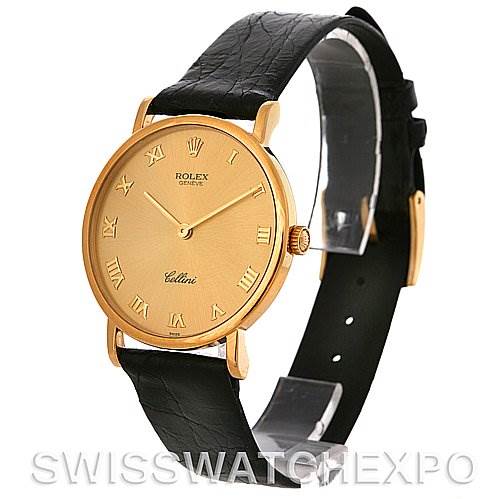 This image shows a Rolex Cellini 5112 Men
s Yellow Gold Champagne Dial 5112 Men
s Yellow Gold Champagne Dial watch at a slight angle, highlighting its round gold case, black leather strap, and Roman numeral dial.