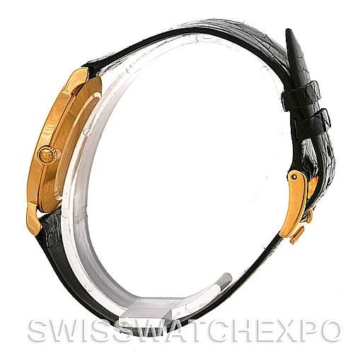 The image shows a side view of a Rolex Cellini 5112 Men
s Yellow Gold Champagne Dial 5112 Men
s Yellow Gold Champagne Dial watch, highlighting its gold case, black leather strap, and clasp.